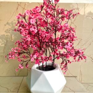 Pink cherry blossom stems in diamond planter