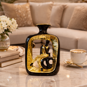 Black and Gold Vase Sculpture with Seated Figure
