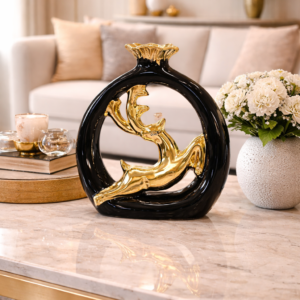 Black and Gold Leaping Deer Sculpture on Marble Coffee Table