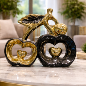 Elegant Gold and Black Apple Figurines with Heart Detail