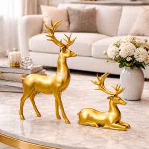 Elegant Gold Reindeer Figurines on Marble Coffee Table