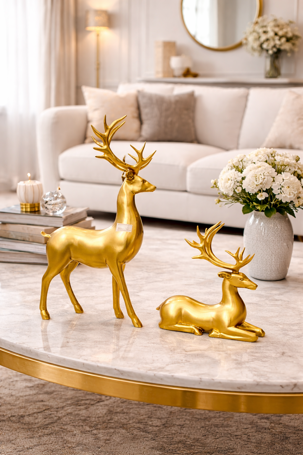Elegant Gold Reindeer Figurines on Marble Coffee Table